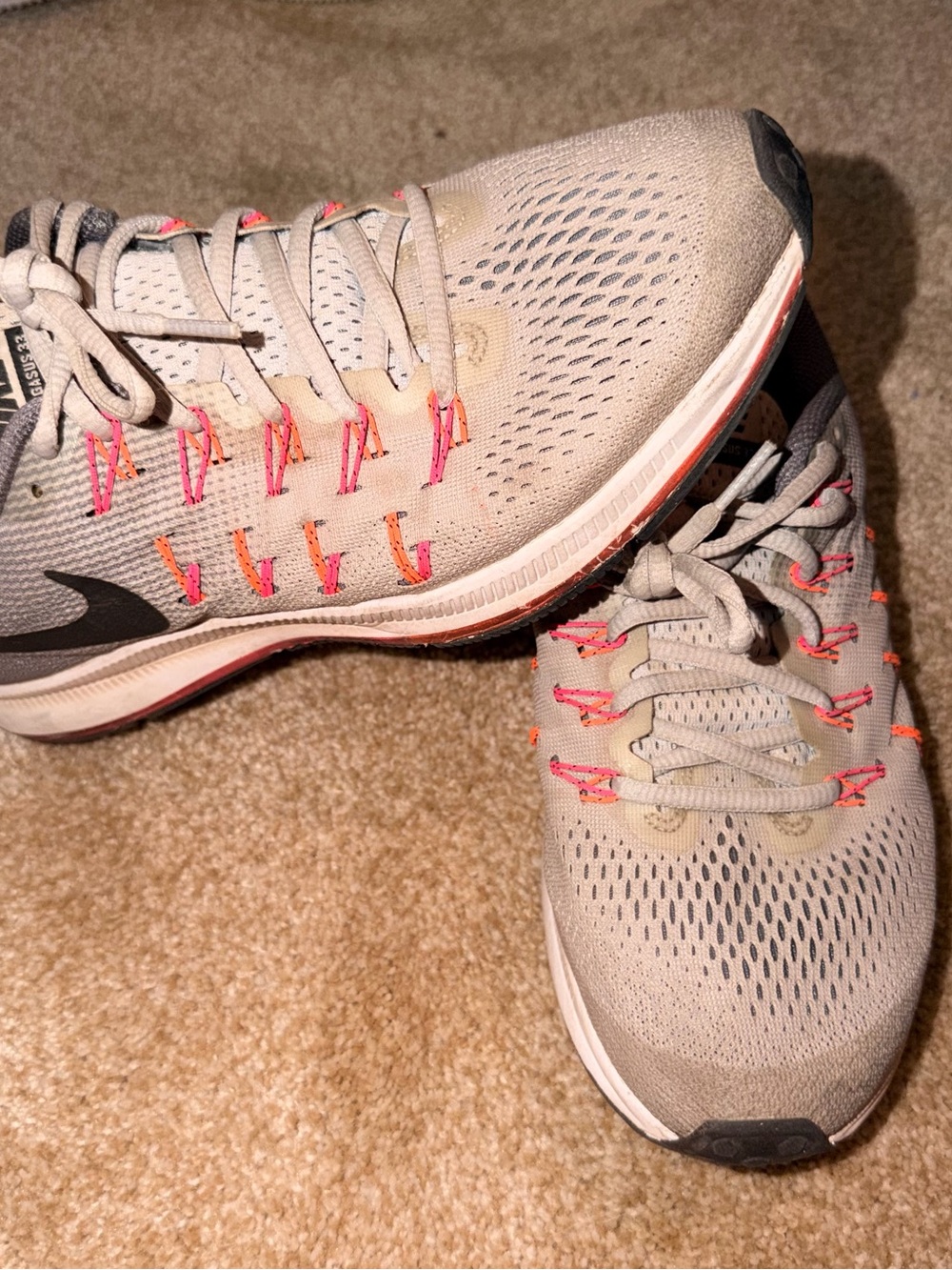 Nike Women's Light Gray Running Shoes with Pink Accents